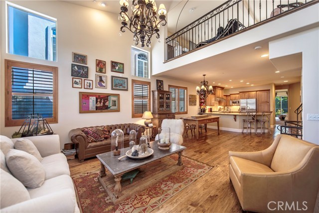 View of the open floorplan towards the kitchen with the mezzanine level above