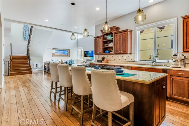 View of how the kitchen flows seamlessly into living area.  Ideal for entertaining your guests