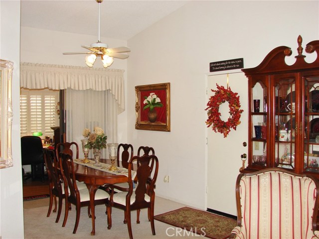 VIEW FROM LIVING ROOM TO FORMAL DINING AREA AND DEN/HOME OFFICE IN BACKGROUND.