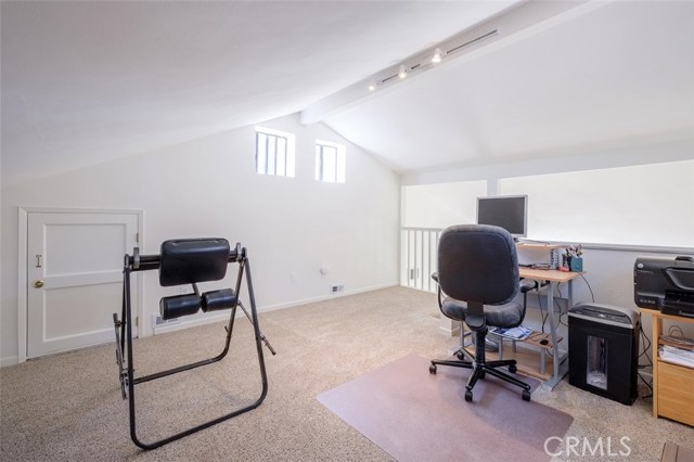 View of Loft from back corner. Additional storage behind door