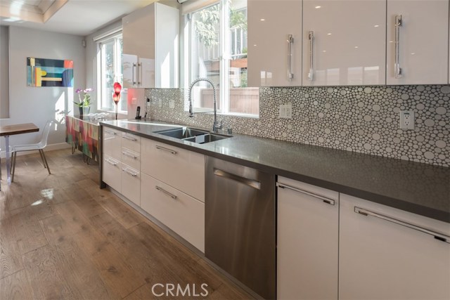 Tile backsplash and door handles were specifically chosen to enhance upgraded decor