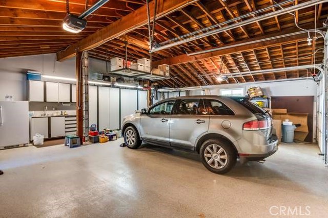 Over-sized 3 Car Garage (Epoxy floor) with Sink / Built in Cabinets and RV Parking.