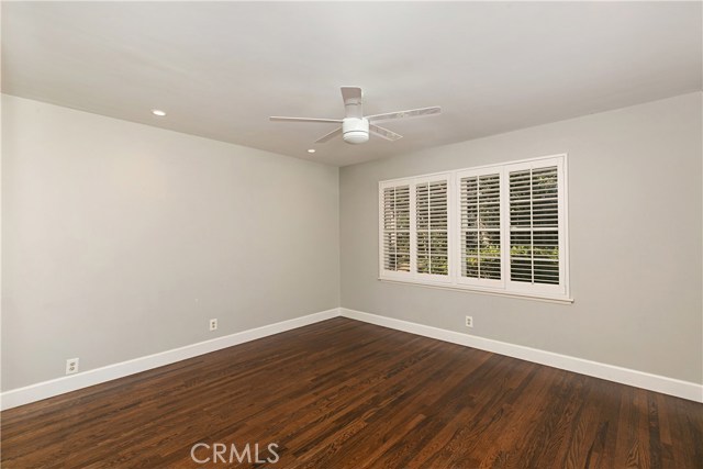 Guest Bedroom #1 with plantation shutters, front of property.