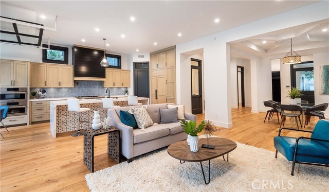 The Great Room with 11' high ceilings flows naturally to the beautiful kitchen.