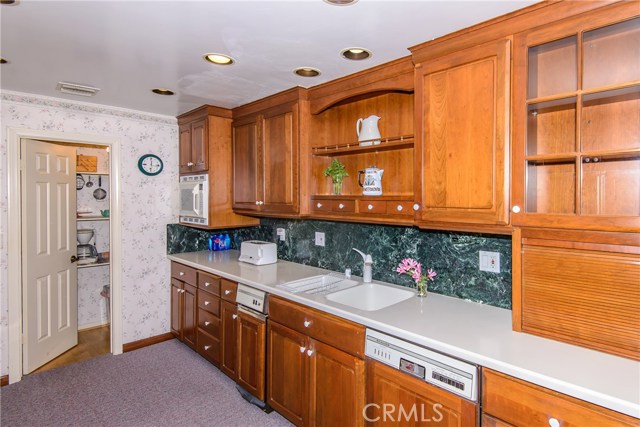Coriann counters and custom wood cabinets in the updated kitchen!
