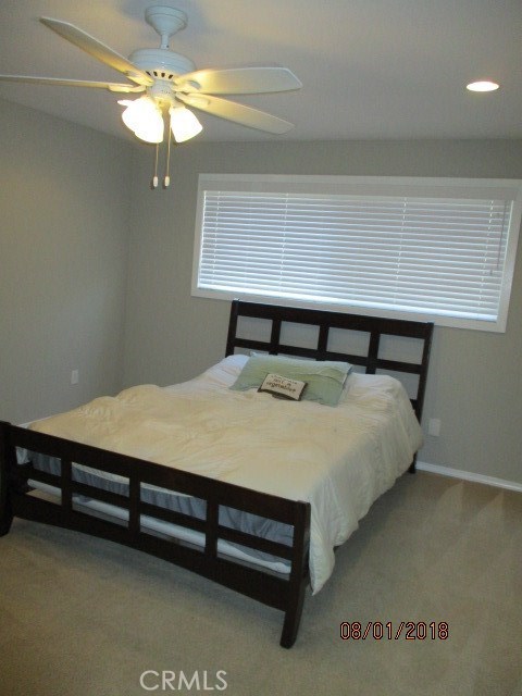 Aprox. 12X11 large size bedroom with room for office space or a dressing area for example. Remote controlled ceiling fan and recessed lighting present.