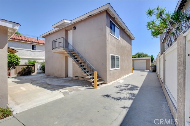 2 units at rear unit B is lower and unit C is top floor driveway to 5 car garages