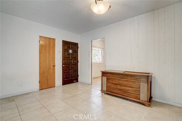 The solid wood front door, and coat closet are just inside the home.  The kitchen has a pocket door which can be closed when guests arrive.