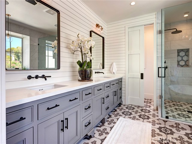 Master bathroom with dual sinks, walk-in shower, soaking tub, and water closet.  Whole home surround sound.