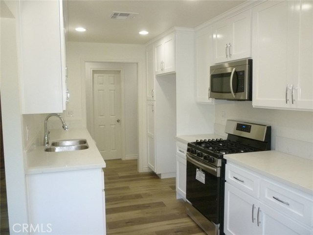 All new kitchen cabinets, stainless steel appliances and flooring.
