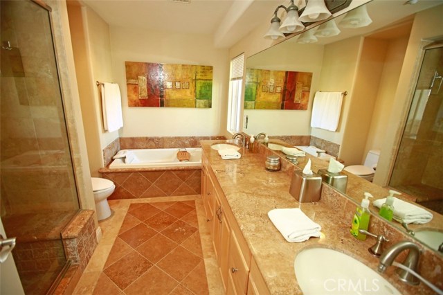 Stunning master bath with spa tub and separate Travertine shower!