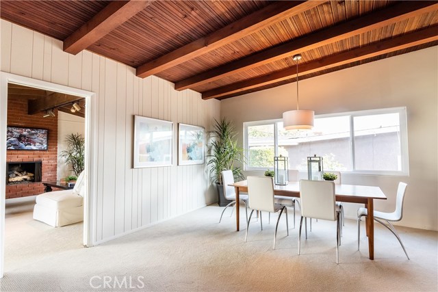 View from living room toward family room at rear and dining area.