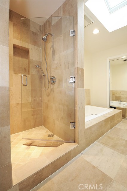 Elegant Master Bath shower and tub.