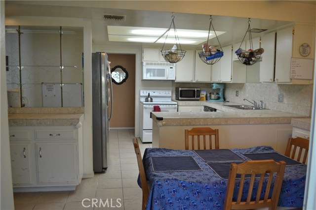 Kitchen view from sliders to backyard.