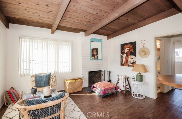 Living room showcases a fireplace.