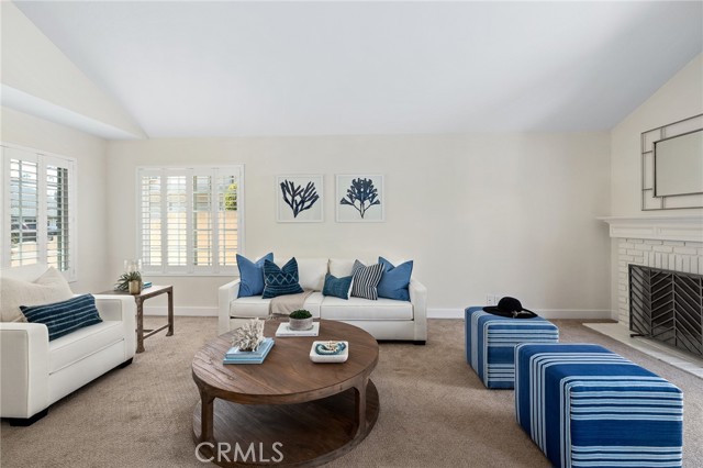 Enjoy time with family and friends sitting by the fireplace.