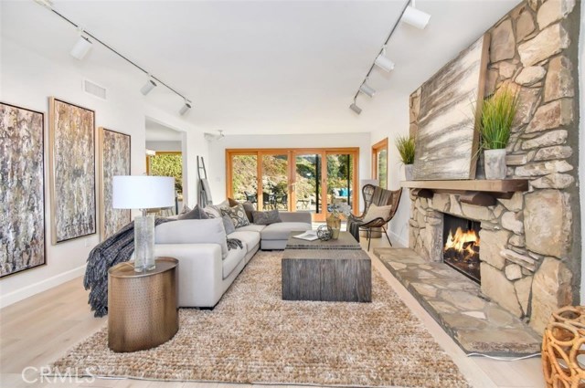 Large living room with fireplace, Anderson sliding doors open to the backyard