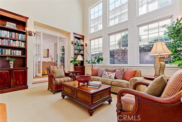 Spacious formal living room with adjacent family room.