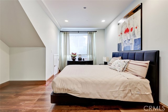 off bedroom with hardwood flooring