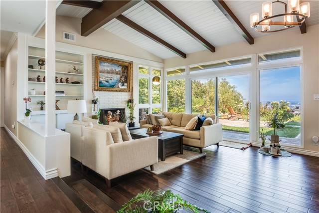 This living space, kitchen and second living area all open up to the backyard