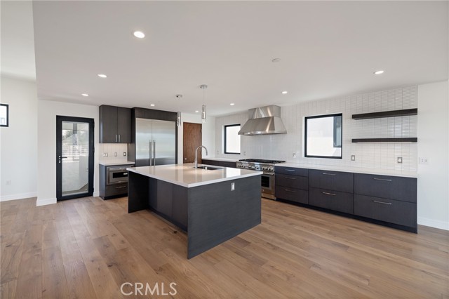 Central kitchen with functional layout and designer flavor leads to spectacular roof top deck