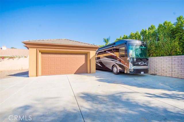 Separate, 2-Car Garage with RV Parking on the side, and lots of room.