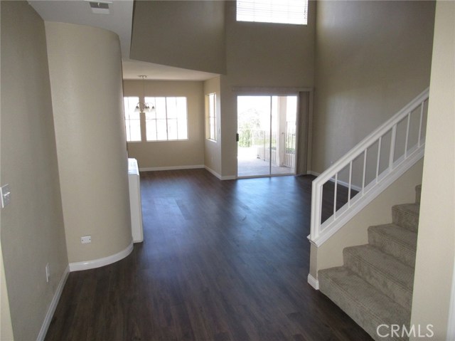 Front Door Entry to Living Room and Dining Area. High 2 story Cathedral Ceilings.