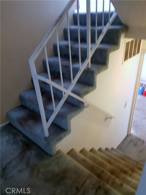 Stairs, Down to; Garage & Laundry - Up to; Kitchen Dining 2nd patio & 1/2 bath.