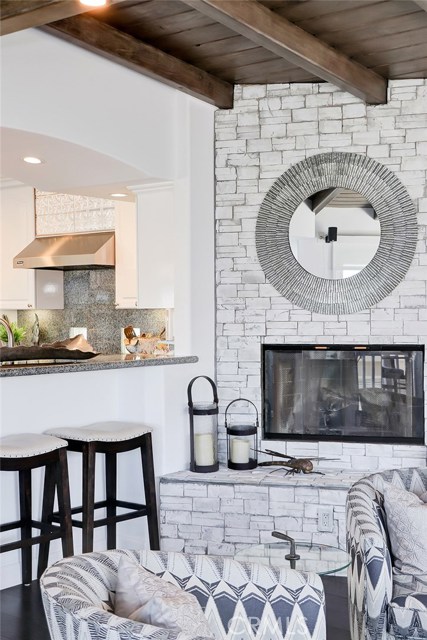 Formal Living/Great Room Area with Stone Fireplace and Bench Sitting Hearth.