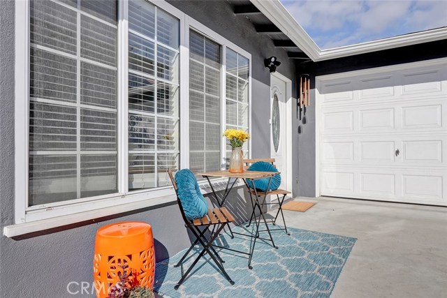 Wonderful driveway doubles as a patio for relaxing and enjoying the summer breeze while sipping your morning coffee.