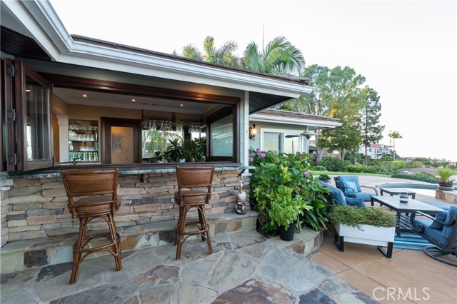 You will LOVE the bar area, which opens onto the patio & also to the great room. This home with its unbeatable view and grounds will make you feel like you are on a permanent vacation!