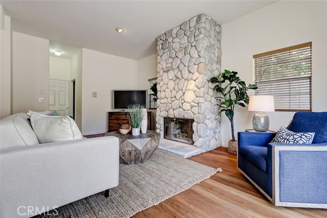 Back living room with wood burning fireplace