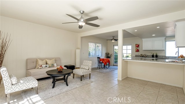 Family room, breakfast area and kitchen with breakfast bar from door to backyard