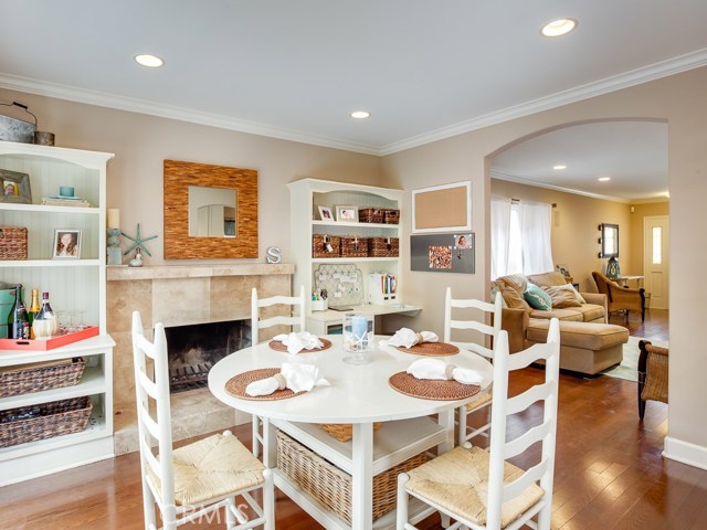 Dining room is open to living room and kitchen.  Beautiful built-in bookcases flank the fireplace.