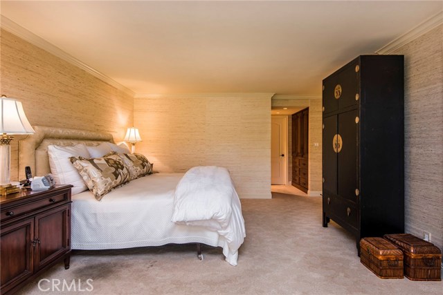 The master suite is spacious and graciously appointed with a sophisticated color palette and grass cloth wall covering. You instantly relax and unwind in this intentionally peaceful, calming environment.
