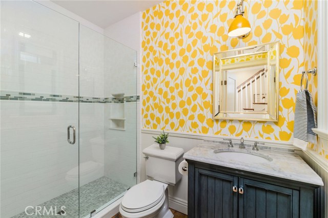 This delightful powder room has the luxury of added shower - for after the beach or for the comfort of the fifth bedroom to access.