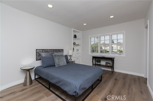 Downstairs bedroom with attached ¾ bath.  Same gorgeous wood floors!!