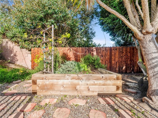 The gorgeous backyard of this 11,000+ sq. ft. lot is versatile and limitless in possibilities. Ready to grow your garden of fruits and vegetables in this planter.