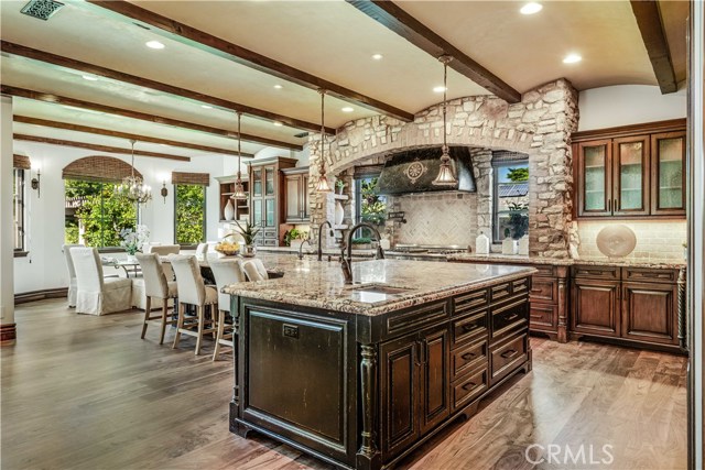 Gourmet kitchen with massive kitchen island and 3 ovens