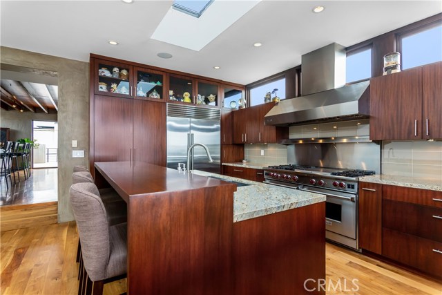 Sub Zero refrigerator, Wolf Double oven and 6 burner stove with griddle