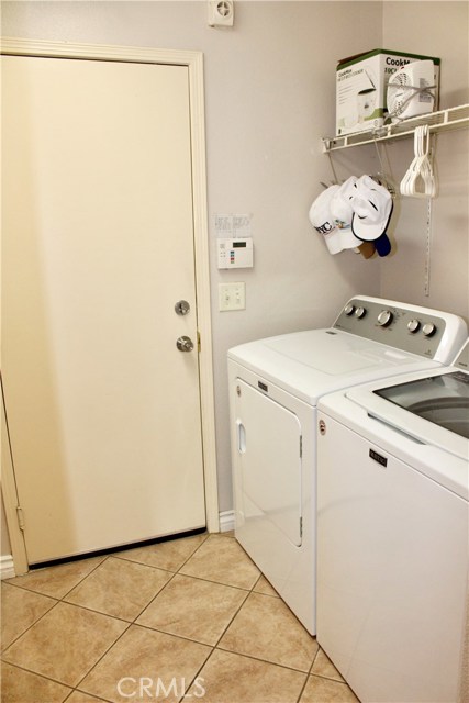 Laundry area with shelve and closet