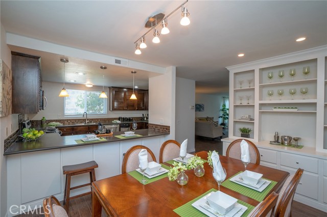 Looking into the lovely kitchen from the Eating area (this space can also be used as a family room). Custom built in Hutch allows for displaying your favorite collectibles or your fine stemware.