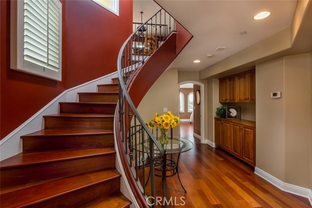The entry at the middle level, with a beautiful curved staircase.
