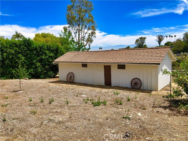 Classic two stall barn with 10x10 stalls and Feed and Tack area. There is direct access along the side easement to ride up to Flying Mane or down an easy trail to Crest. Owners had an orchard in front originally and horses in back by the stall doors. This is potentially one of two areas that could be expanded.