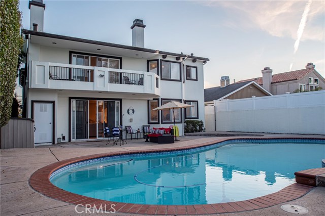 Over-sized heated pool with permitted full sized pool bathroom, there is still alot of room for parties, tables chairs, this is a big backyard!