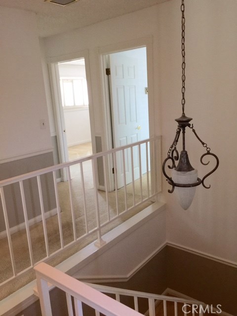 Front house stairway, chandelier, custom paint