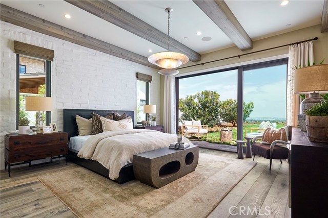 Master suite with its own private patio and stacked sliding glass doors. Model home shown.