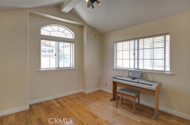 Bedroom 2 of 4, vaulted ceiling, ceiling fan and hard wood floor