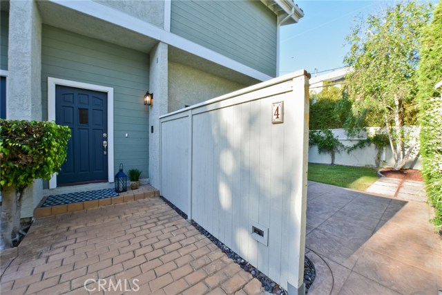 Front door and entrance to private patio and yard.