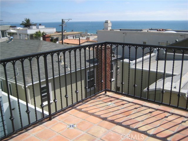 Spanish tile patio and classic wrought iron railings...